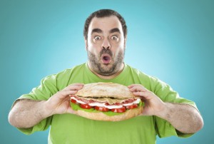 Man eats an enormous roll